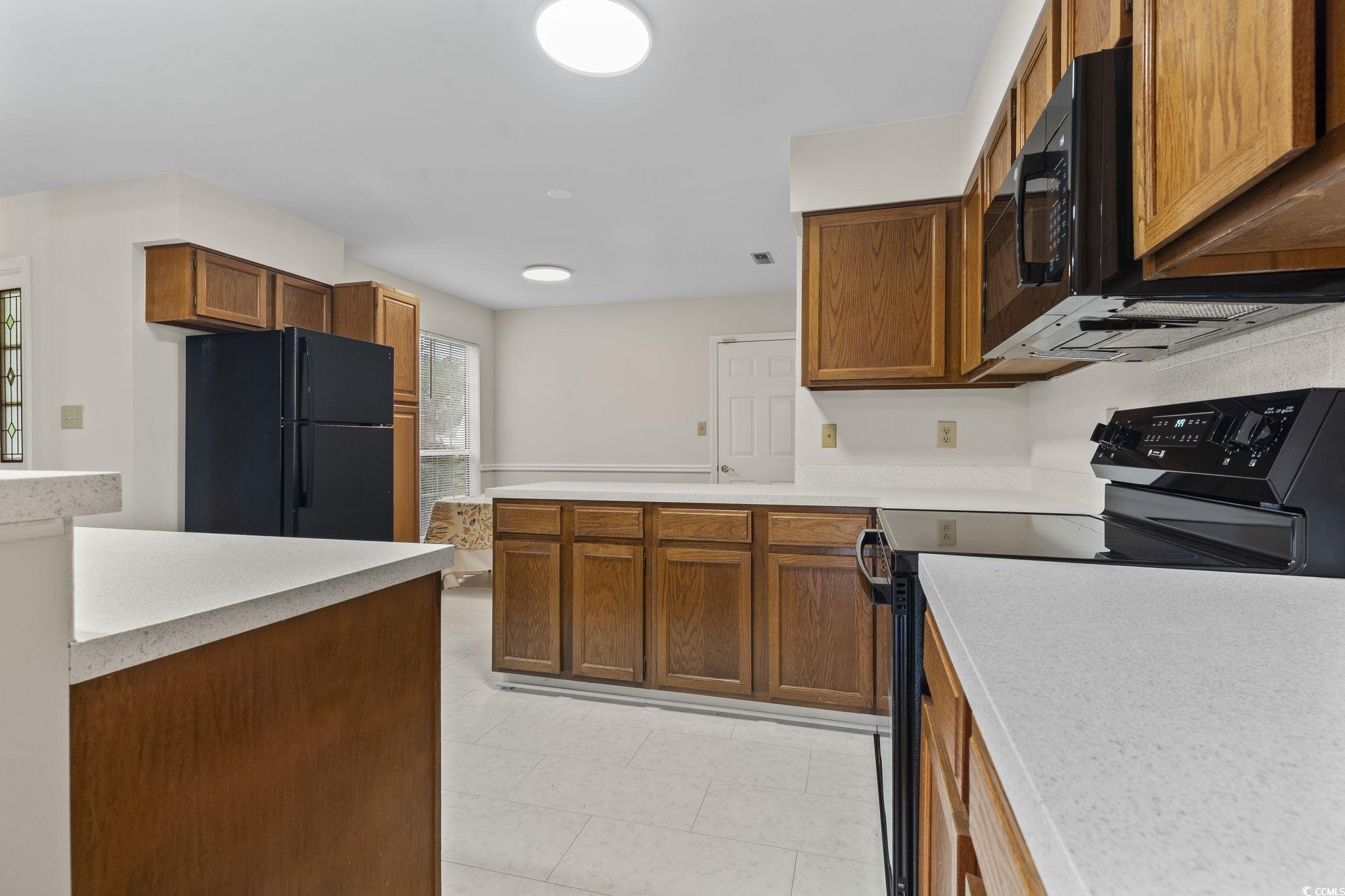 116 Purple Martin Drive Murrells Inlet, SC 29576 - Photo 23 of 40 Kitchen with black appliances