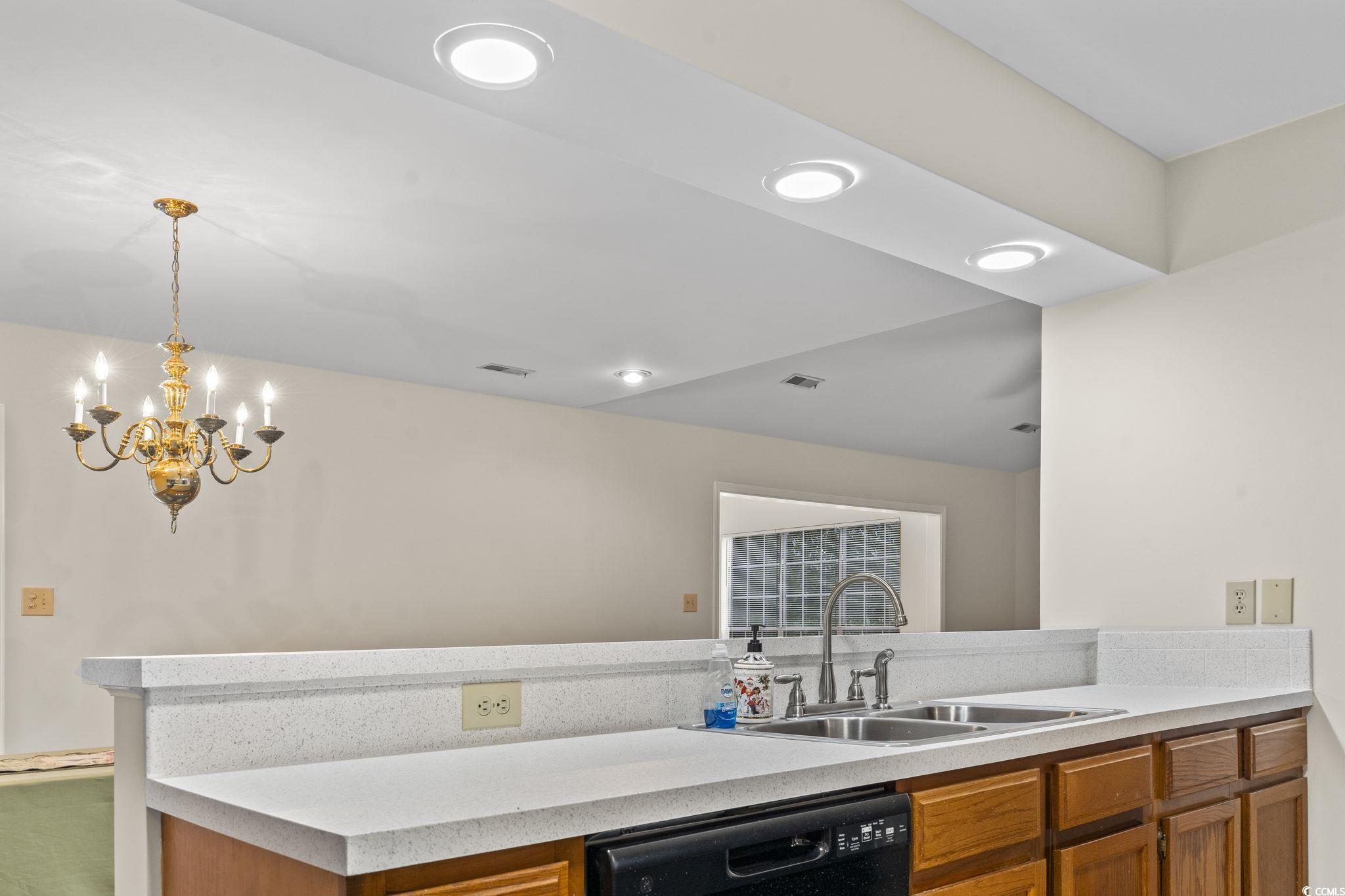 116 Purple Martin Drive Murrells Inlet, SC 29576 - Photo 25 of 40 Kitchen featuring kitchen peninsula, sink, decorat