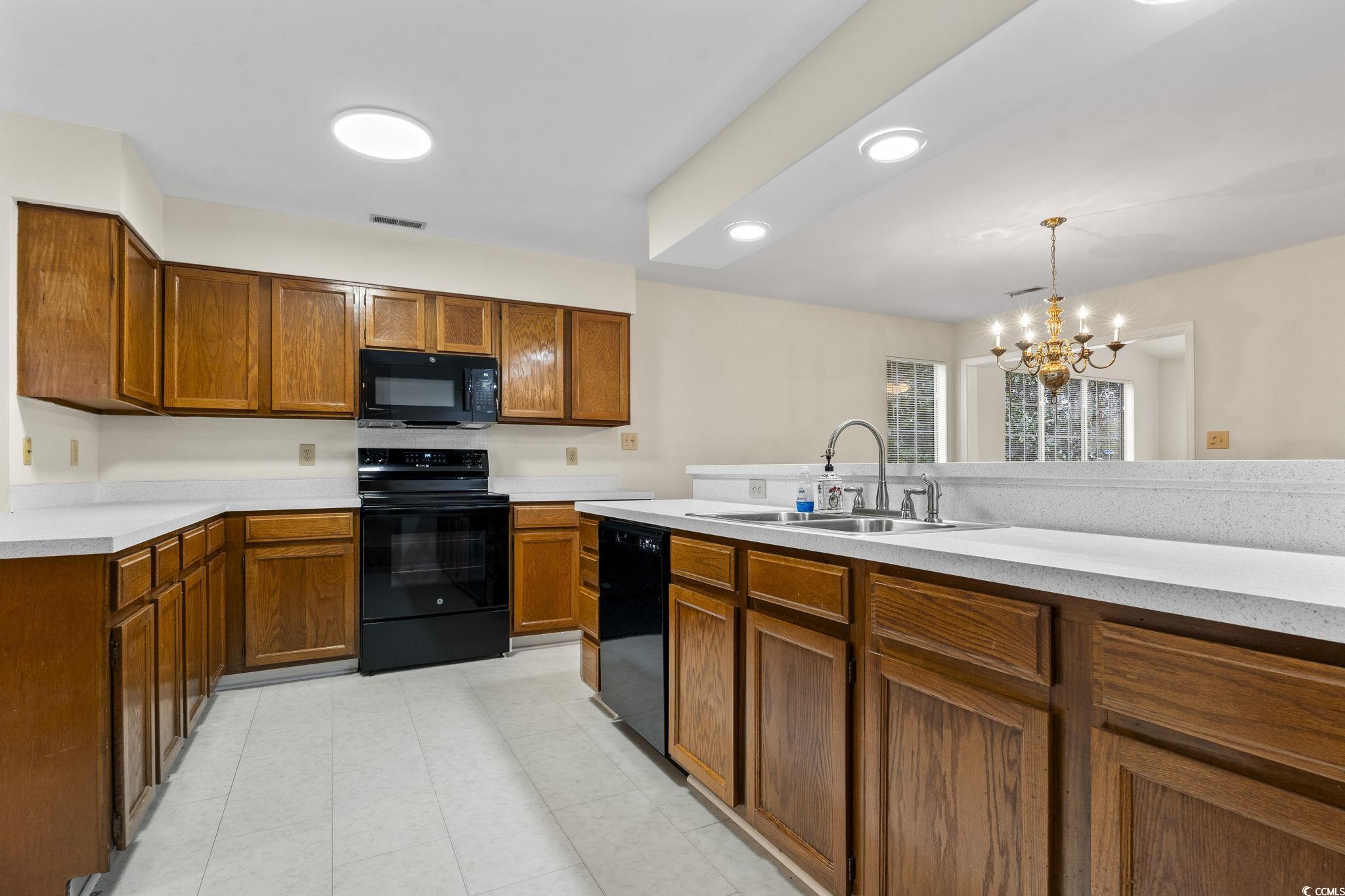 116 Purple Martin Drive Murrells Inlet, SC 29576 - Photo 26 of 40 Kitchen with a chandelier, pendant lighting, sink,