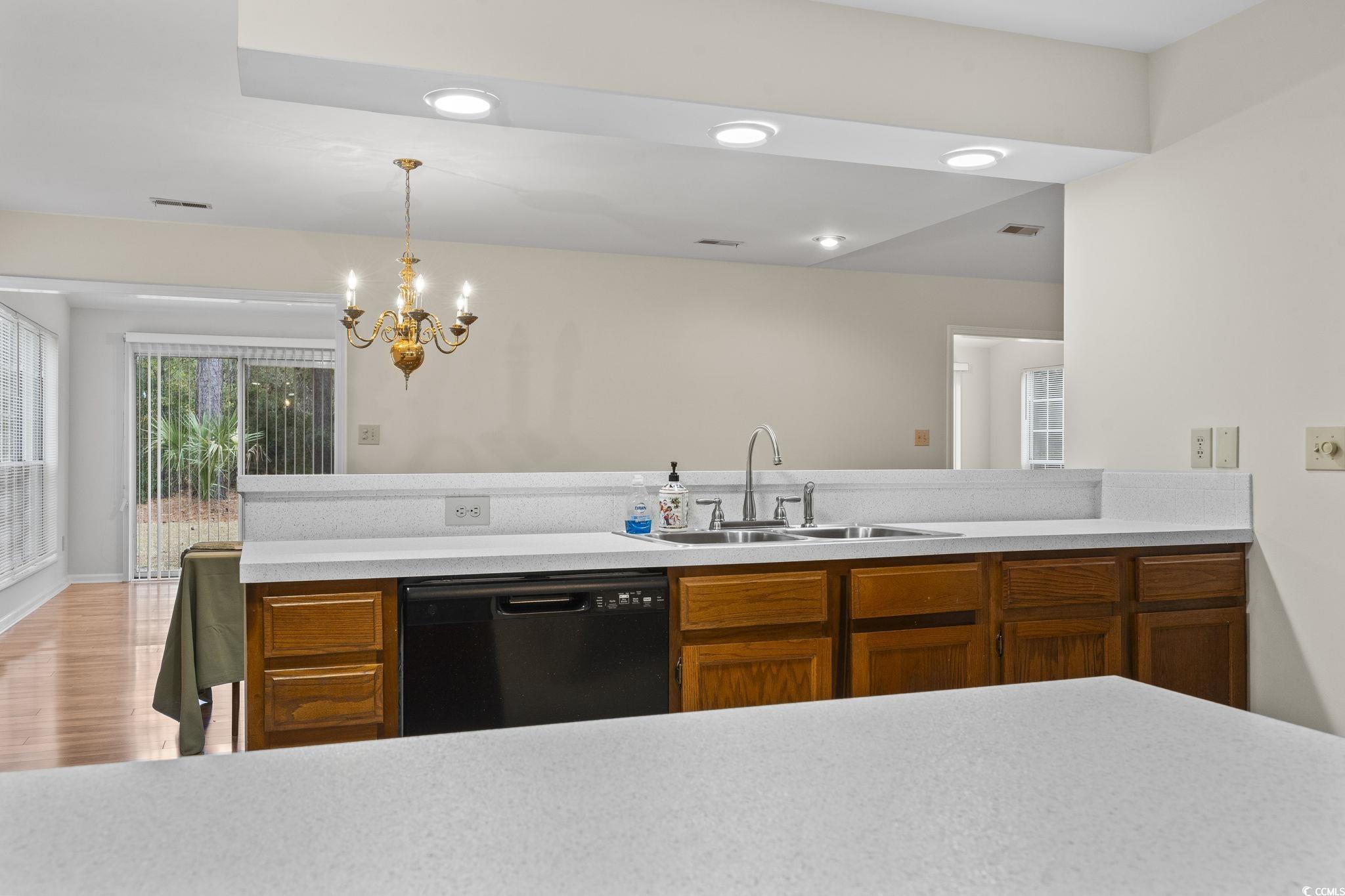 116 Purple Martin Drive Murrells Inlet, SC 29576 - Photo 29 of 40 Kitchen featuring sink, black dishwasher, light ha