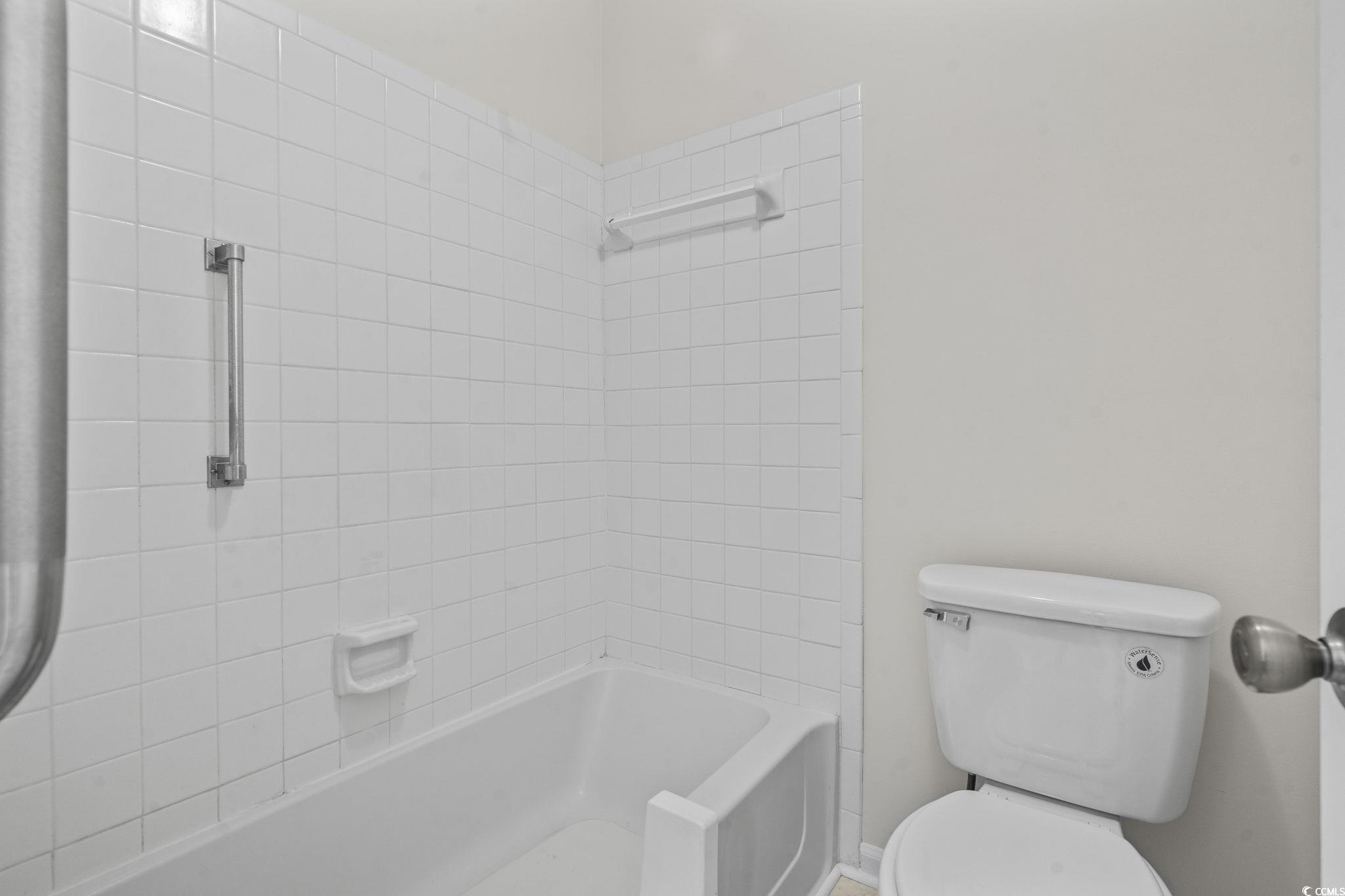 116 Purple Martin Drive Murrells Inlet, SC 29576 - Photo 6 of 40 Bathroom featuring tiled shower / bath combo and t