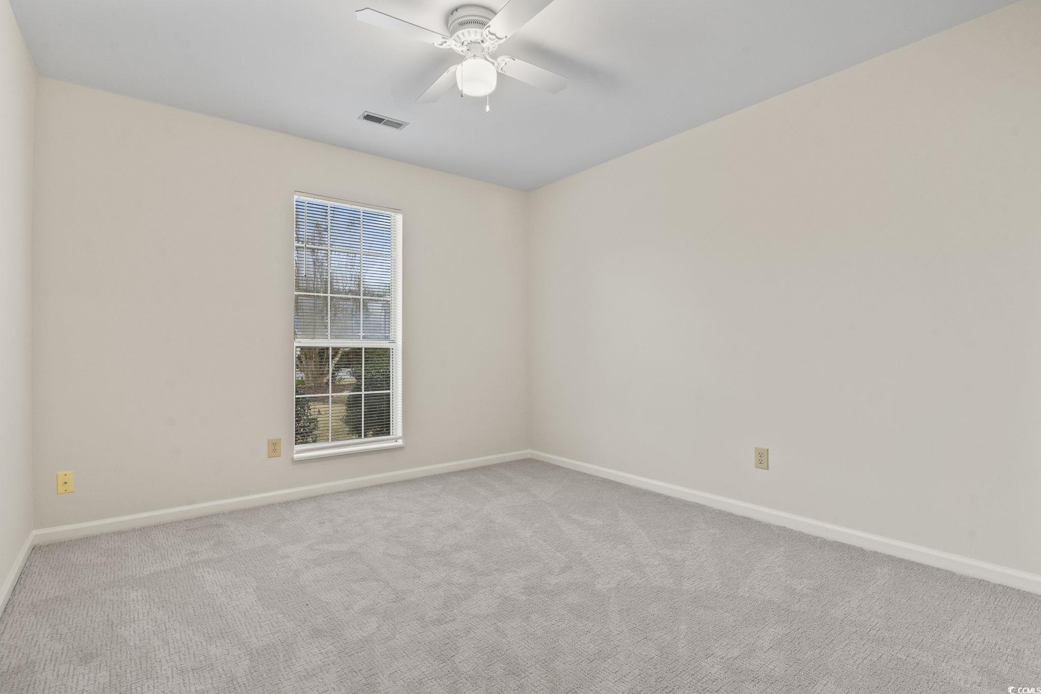 116 Purple Martin Drive Murrells Inlet, SC 29576 - Photo 9 of 40 Carpeted empty room with ceiling fan