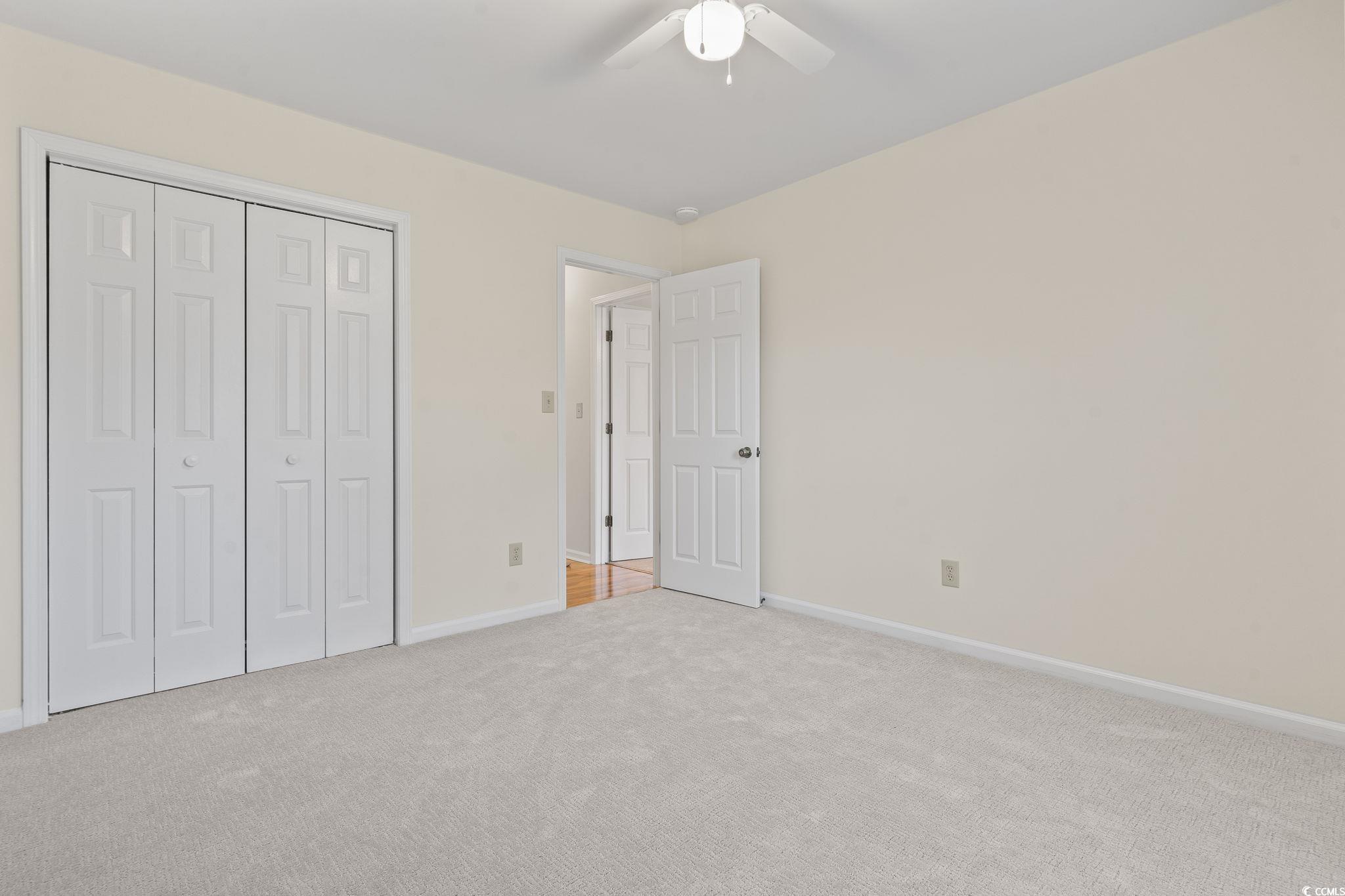 116 Purple Martin Drive Murrells Inlet, SC 29576 - Photo 10 of 40 Unfurnished bedroom with a closet, ceiling fan, an