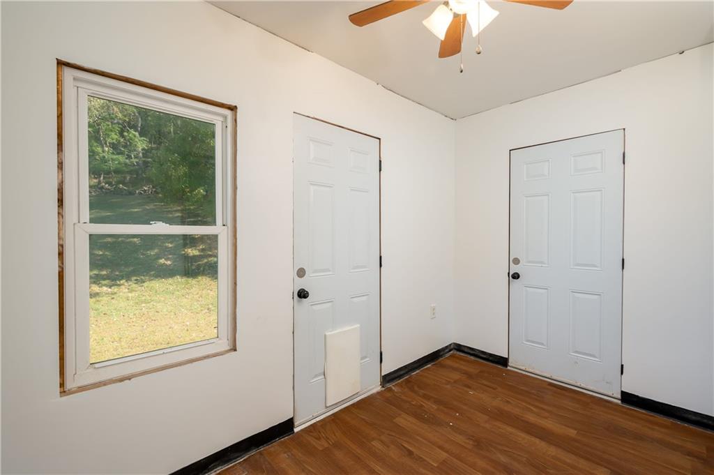 825 Reno Street Rochester, PA 15074 - Photo 11 of 23 a view of an empty room with wooden floor and a window