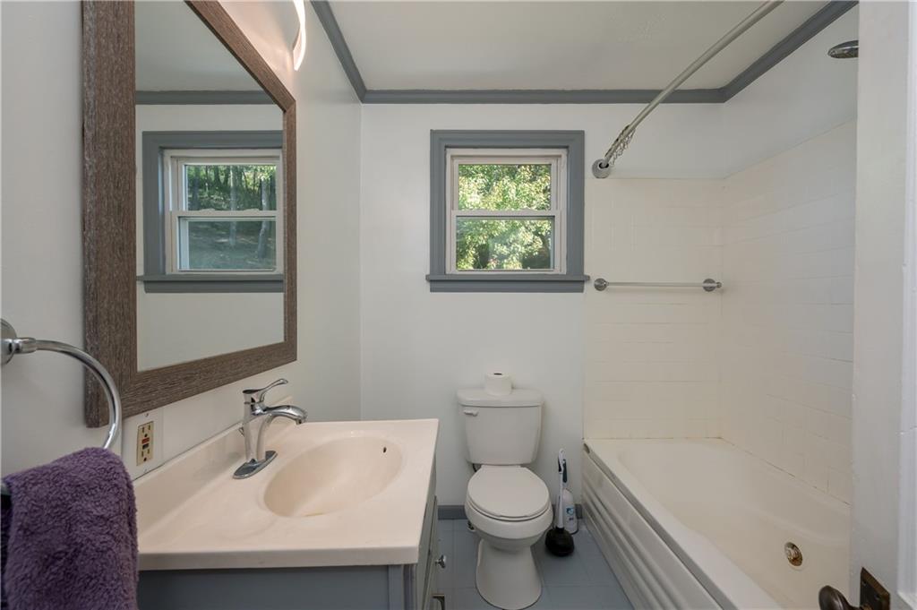 825 Reno Street Rochester, PA 15074 - Photo 12 of 23 a bathroom with a sink and a mirror