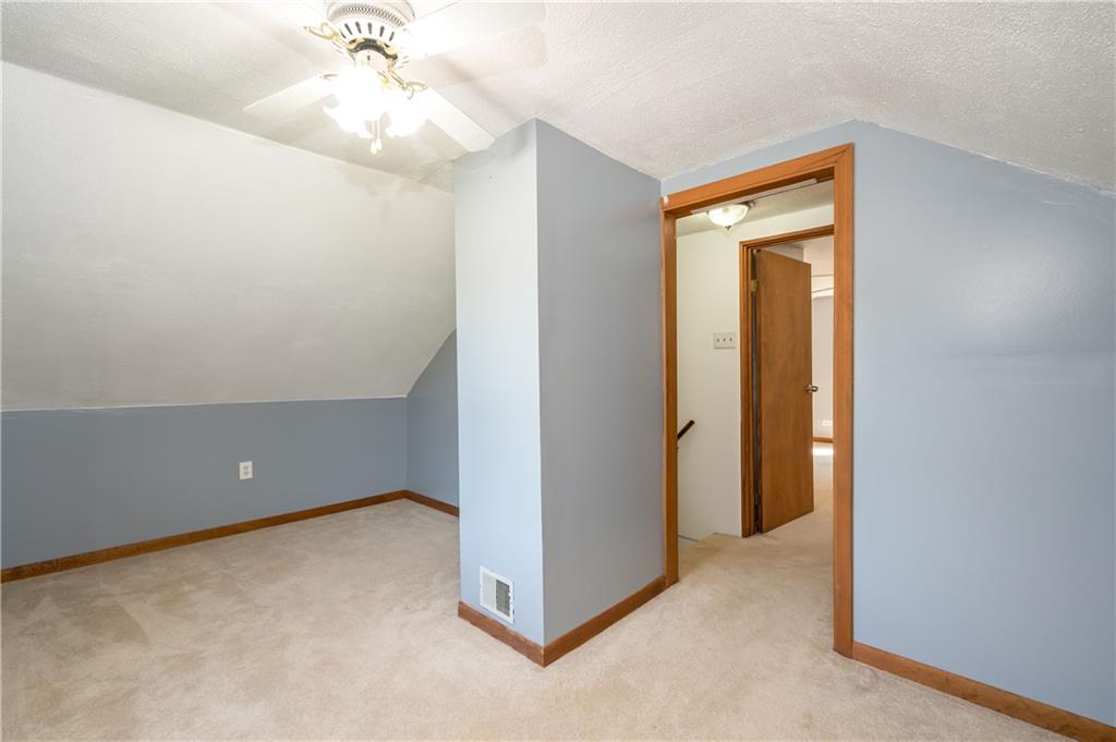 825 Reno Street Rochester, PA 15074 - Photo 18 of 23 an empty room with a chandelier fan and closet