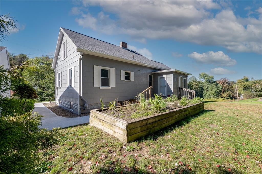 825 Reno Street Rochester, PA 15074 - Photo 21 of 23 a front view of house with yard outdoor seating and green space