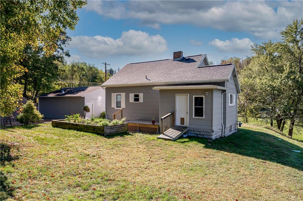 825 Reno Street Rochester, PA 15074 - Photo 22 of 23 a front view of a house with garden