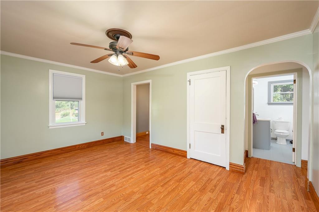 825 Reno Street Rochester, PA 15074 - Photo 4 of 23 a view of empty room with wooden floor and fan