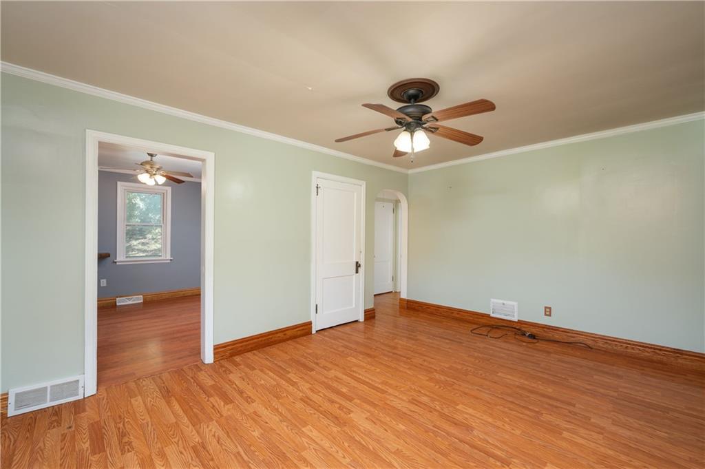 825 Reno Street Rochester, PA 15074 - Photo 5 of 23 a view of a big room with wooden floor and a chandelier fan