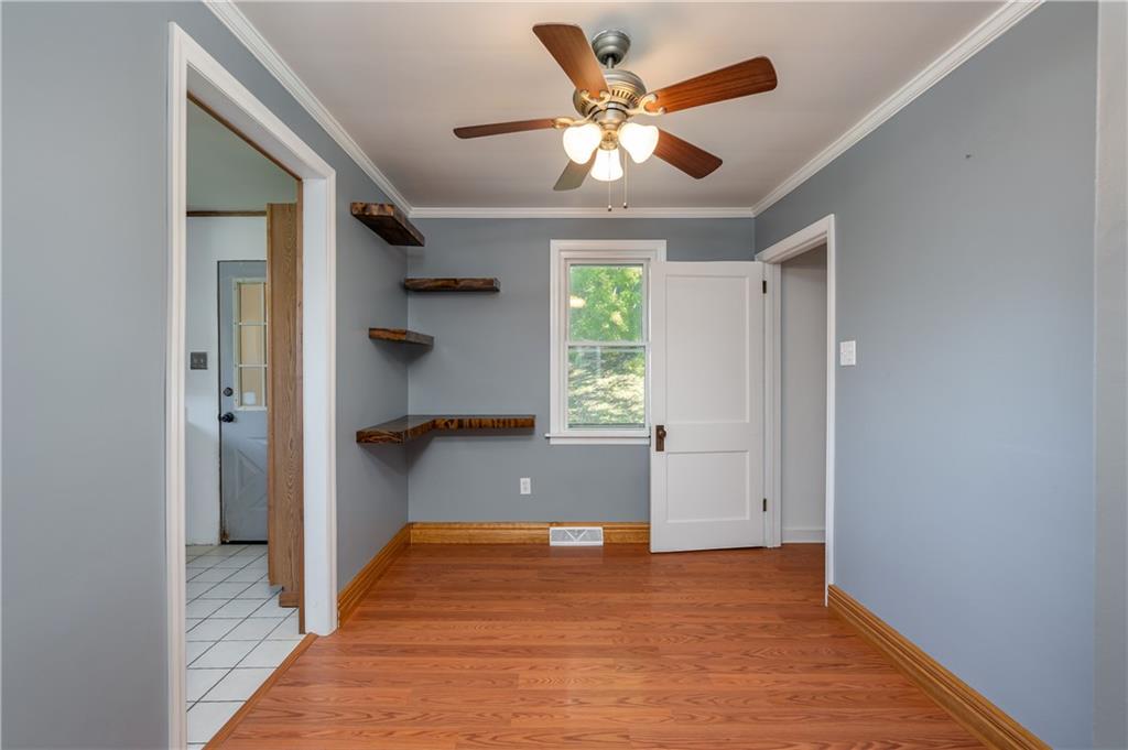 825 Reno Street Rochester, PA 15074 - Photo 6 of 23 wooden floor in an empty room with a window