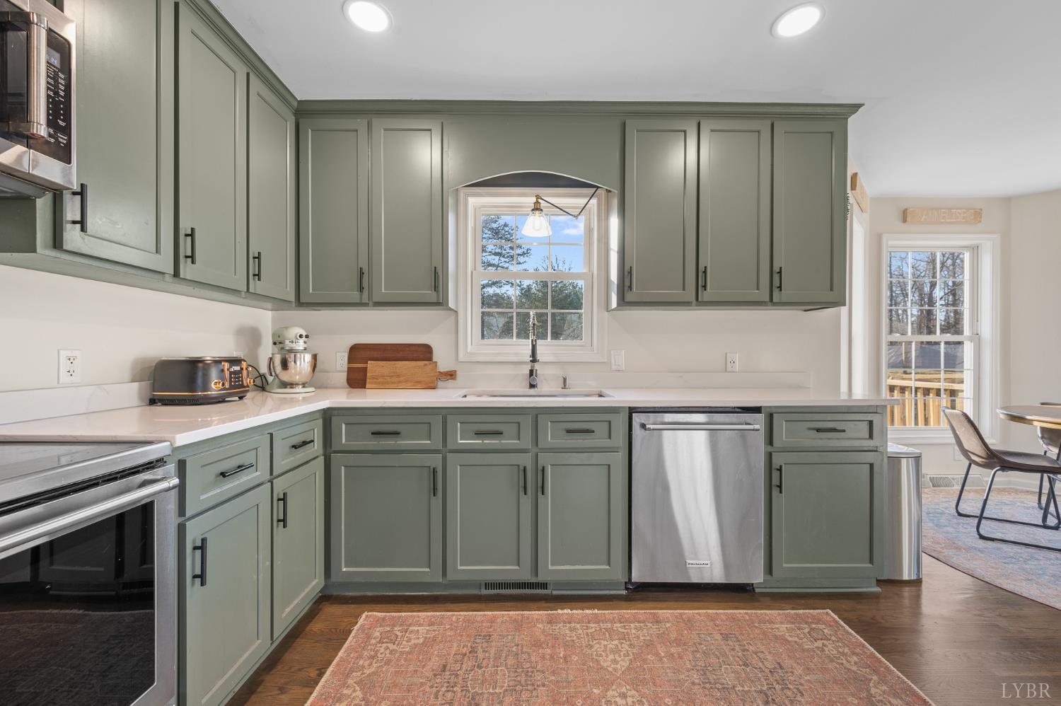 2389 New Chapel Road Rustburg, VA 24588 - Photo 26 of 73 a kitchen with stainless steel appliances granite countertop a sink stove and cabinets