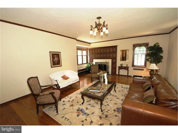 1106 Beech Road Bryn Mawr, PA 19010 - Photo 4 of 21 a living room with furniture and a chandelier
