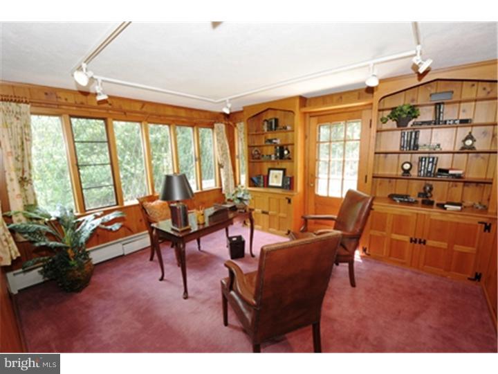 1106 Beech Road Bryn Mawr, PA 19010 - Photo 9 of 21 a living room with furniture a rug and a large window