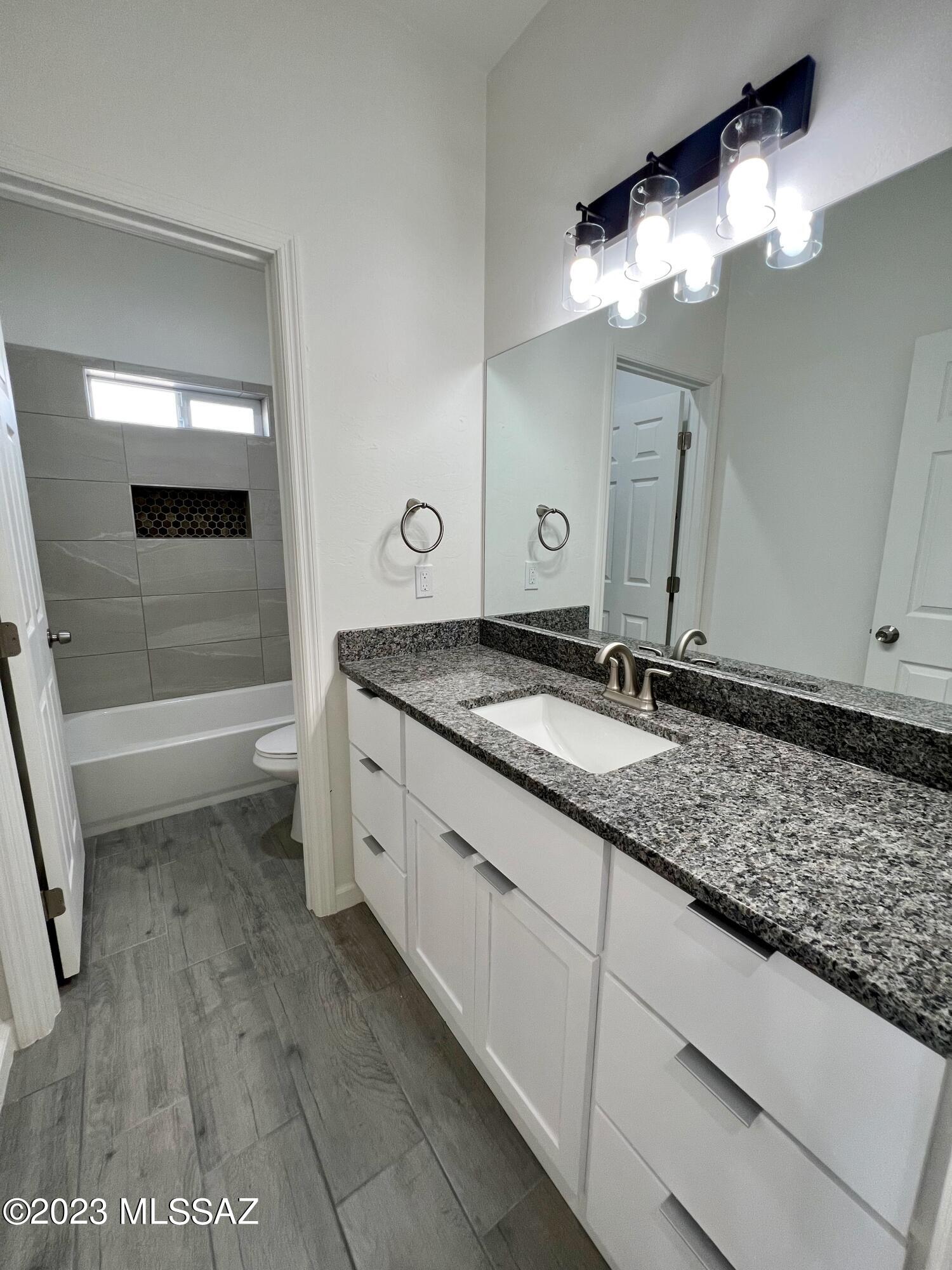 353 Dock Street Rio Rico, AZ 85648 - Photo 35 of 50 a bathroom with a sink and a mirror