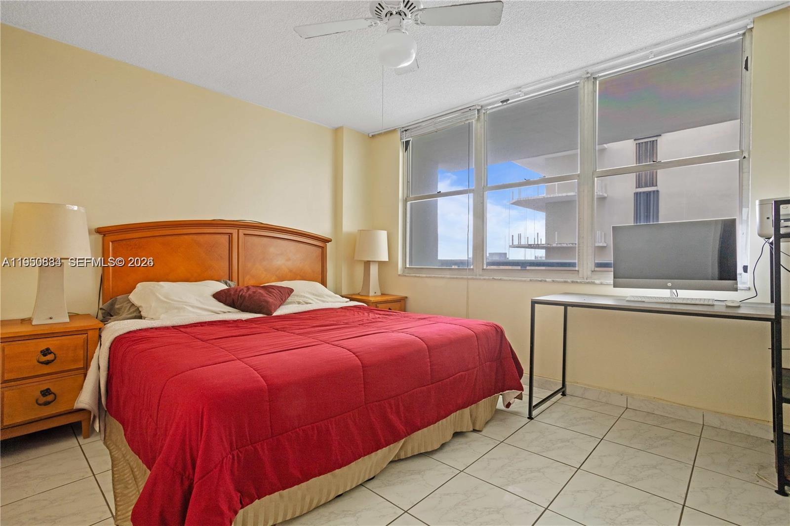 6039 Collins Avenue, Unit 809 Miami Beach, FL 33140 - Photo 11 of 14 a bedroom with a bed and window