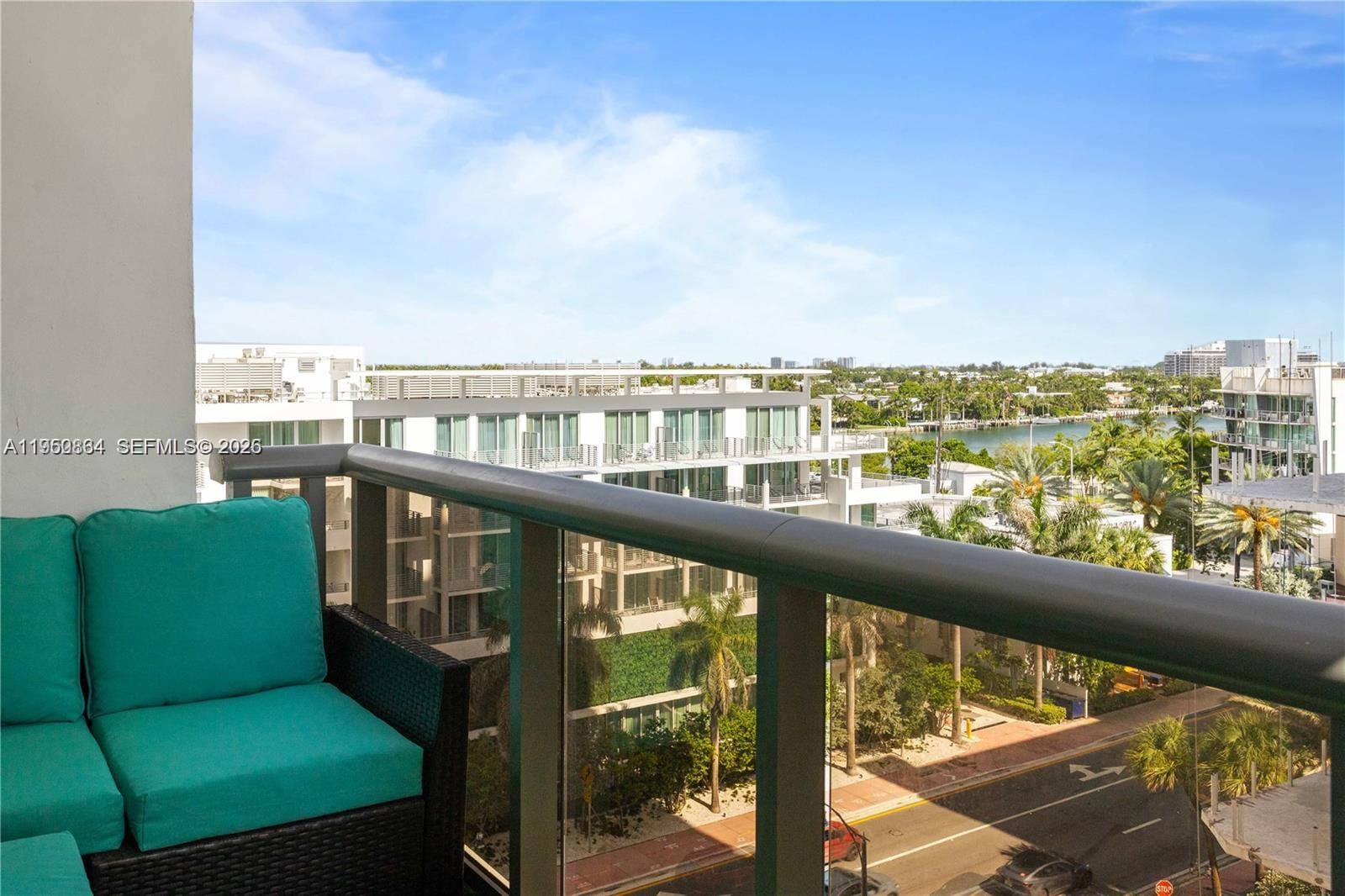 6039 Collins Avenue, Unit 809 Miami Beach, FL 33140 - Photo 2 of 14 a view of a balcony with furniture