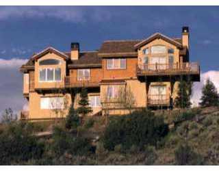 44 Knudson Ranch Road, Unit 5 Edwards, CO 81632 - Photo 1 of 1 a front view of a house with a yard