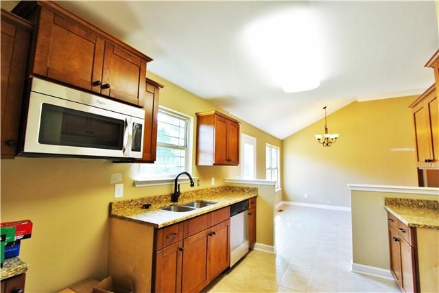 235 Cave Springs Road Lebanon, TN 37087 - Photo 5 of 13 Granite counter-tops and stainless-steel appliances!