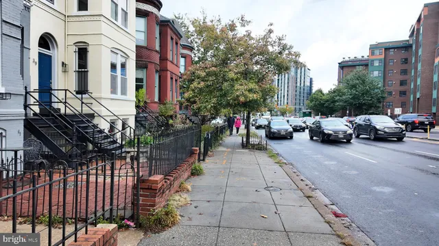a view of a building with cars