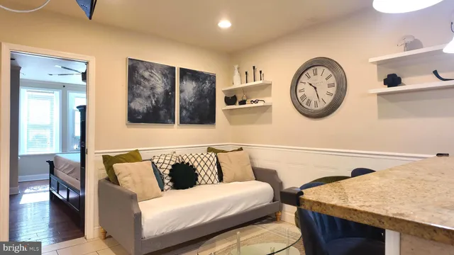 a living room with furniture and a window