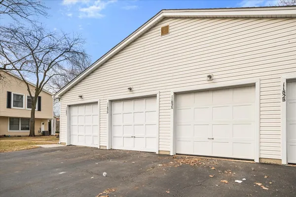 a front view of a house with a garage