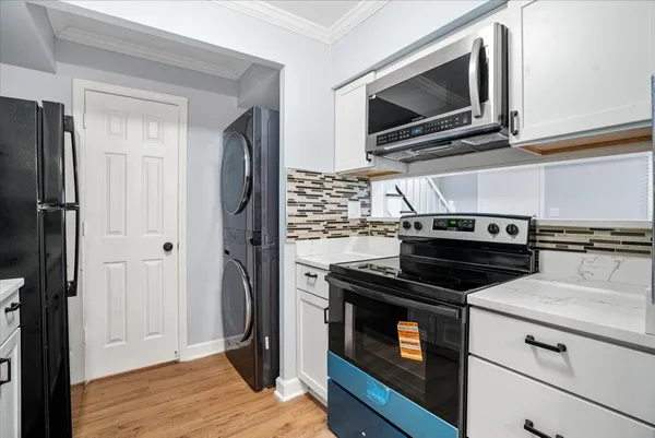 a kitchen with a stove microwave and refrigerator