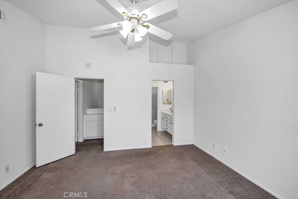 28114 Seco Canyon Road, Unit 156 Saugus, CA 91390 - Photo 16 of 31 an empty room with fan and entrance