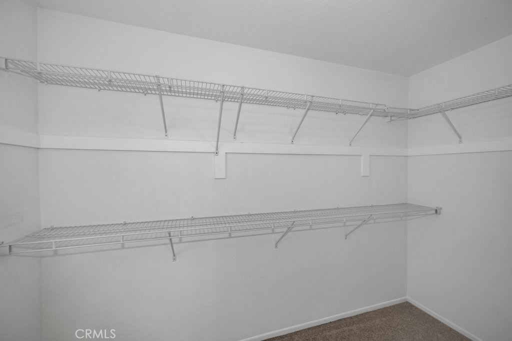 28114 Seco Canyon Road, Unit 156 Saugus, CA 91390 - Photo 18 of 31 a view of a room with racks on the wall