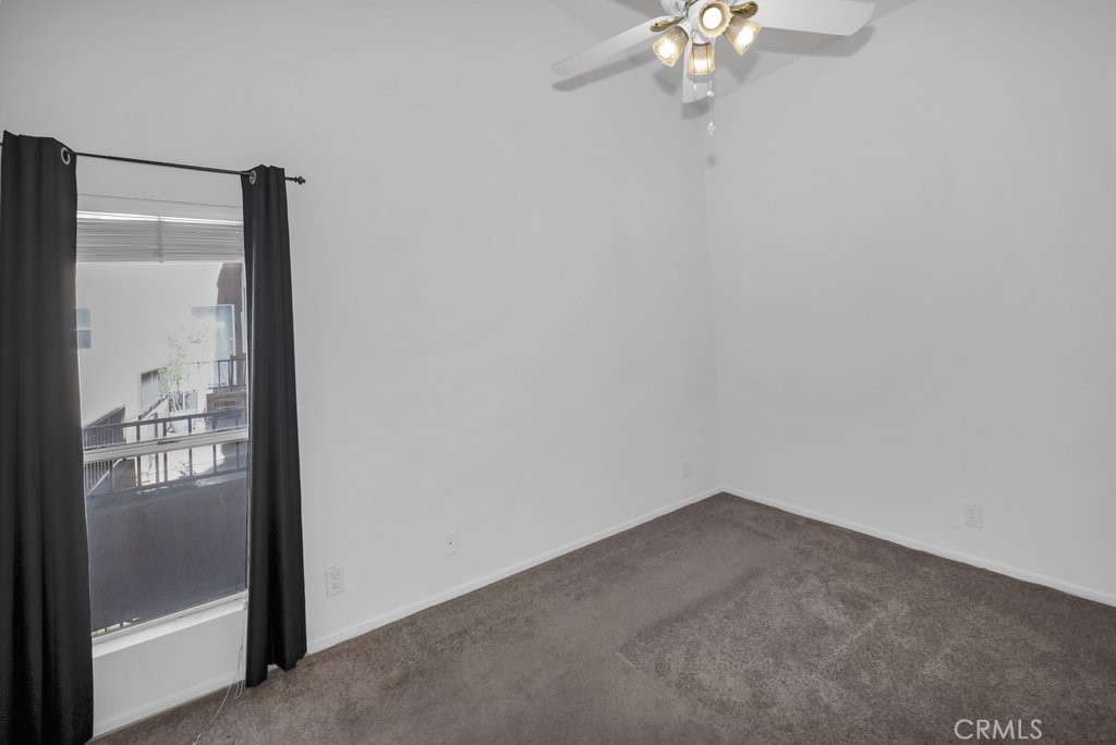 28114 Seco Canyon Road, Unit 156 Saugus, CA 91390 - Photo 20 of 31 a view of a small space with wooden floor and a chandelier