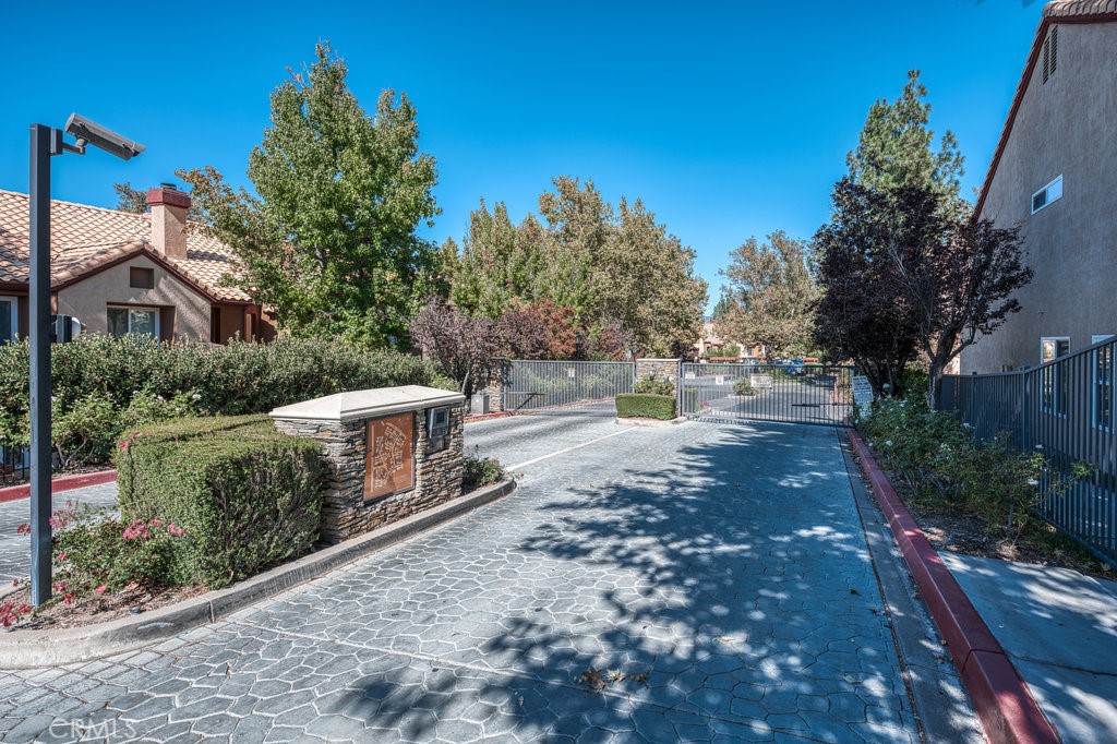 28114 Seco Canyon Road, Unit 156 Saugus, CA 91390 - Photo 3 of 31 a front view of a house with a yard