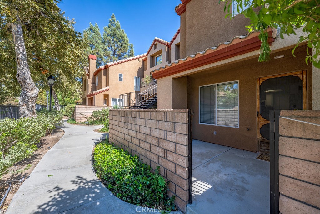 28114 Seco Canyon Road, Unit 156 Saugus, CA 91390 - Photo 5 of 31 a front view of a house with garden