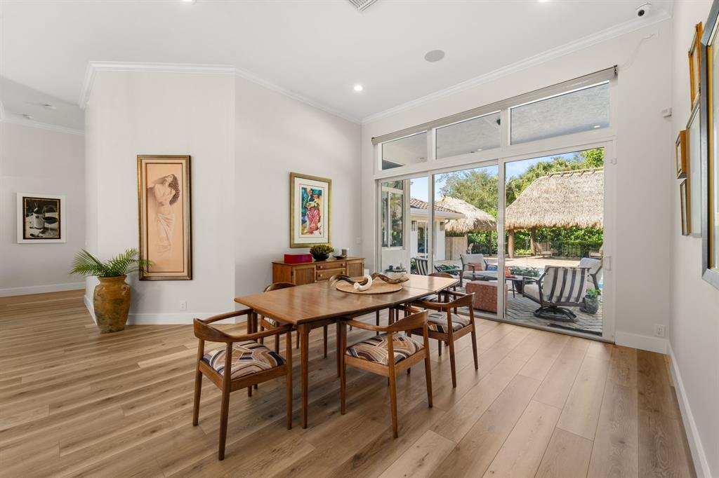 10171 Northwest 59th Drive Parkland, FL 33076 - Photo 17 of 49 a view of a dining room with furniture window and wooden floor