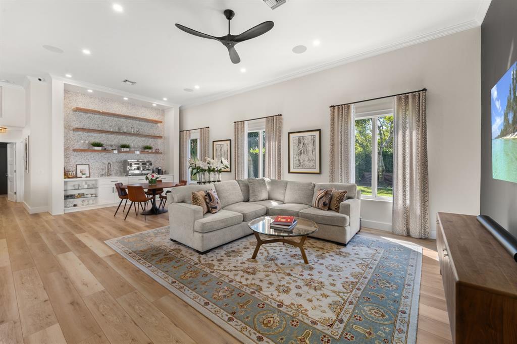 10171 Northwest 59th Drive Parkland, FL 33076 - Photo 27 of 49 a living room with furniture and wooden floor