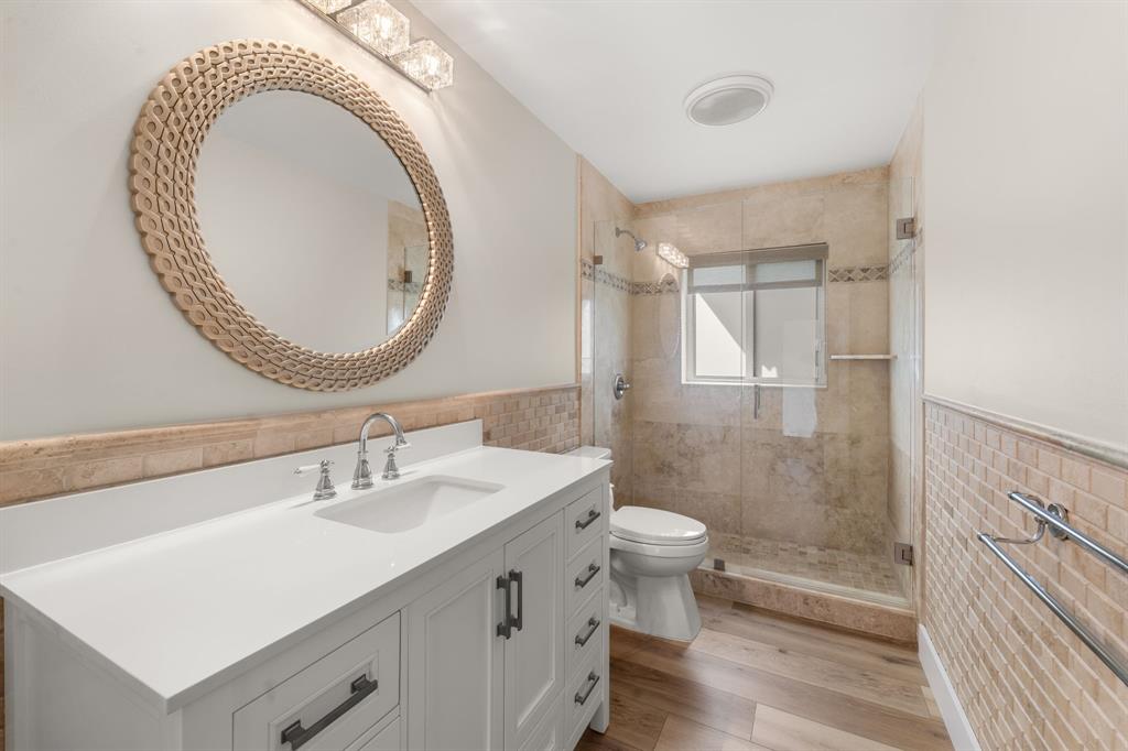 10171 Northwest 59th Drive Parkland, FL 33076 - Photo 30 of 49 a bathroom with a sink a toilet and shower