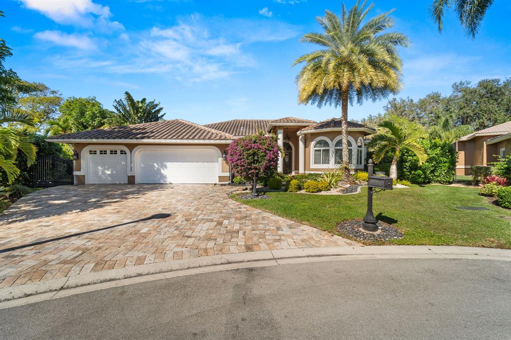 10171 Northwest 59th Drive Parkland, FL 33076 - Photo 34 of 49 front view of house with a yard