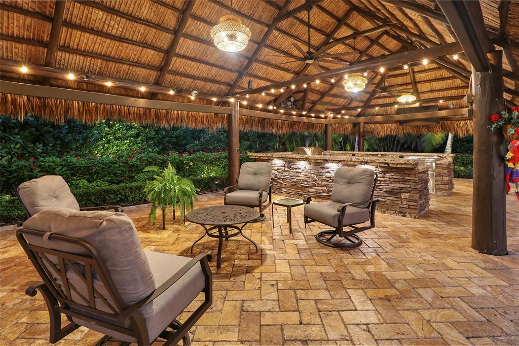 10171 Northwest 59th Drive Parkland, FL 33076 - Photo 7 of 49 a building outdoor space with patio furniture and potted plants