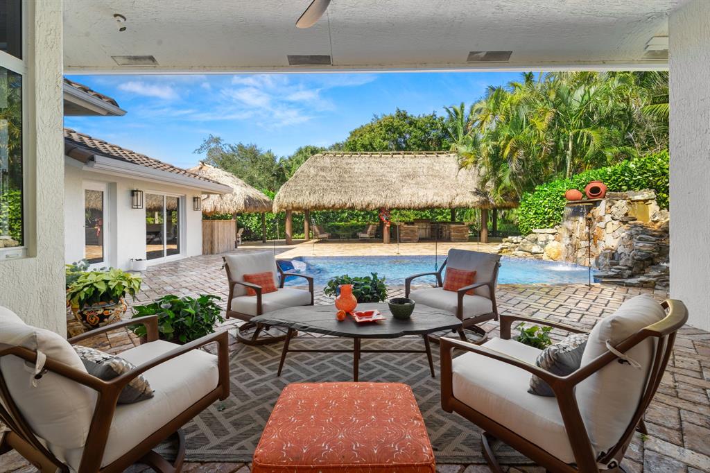 10171 Northwest 59th Drive Parkland, FL 33076 - Photo 10 of 49 a outdoor living space with furniture and garden view