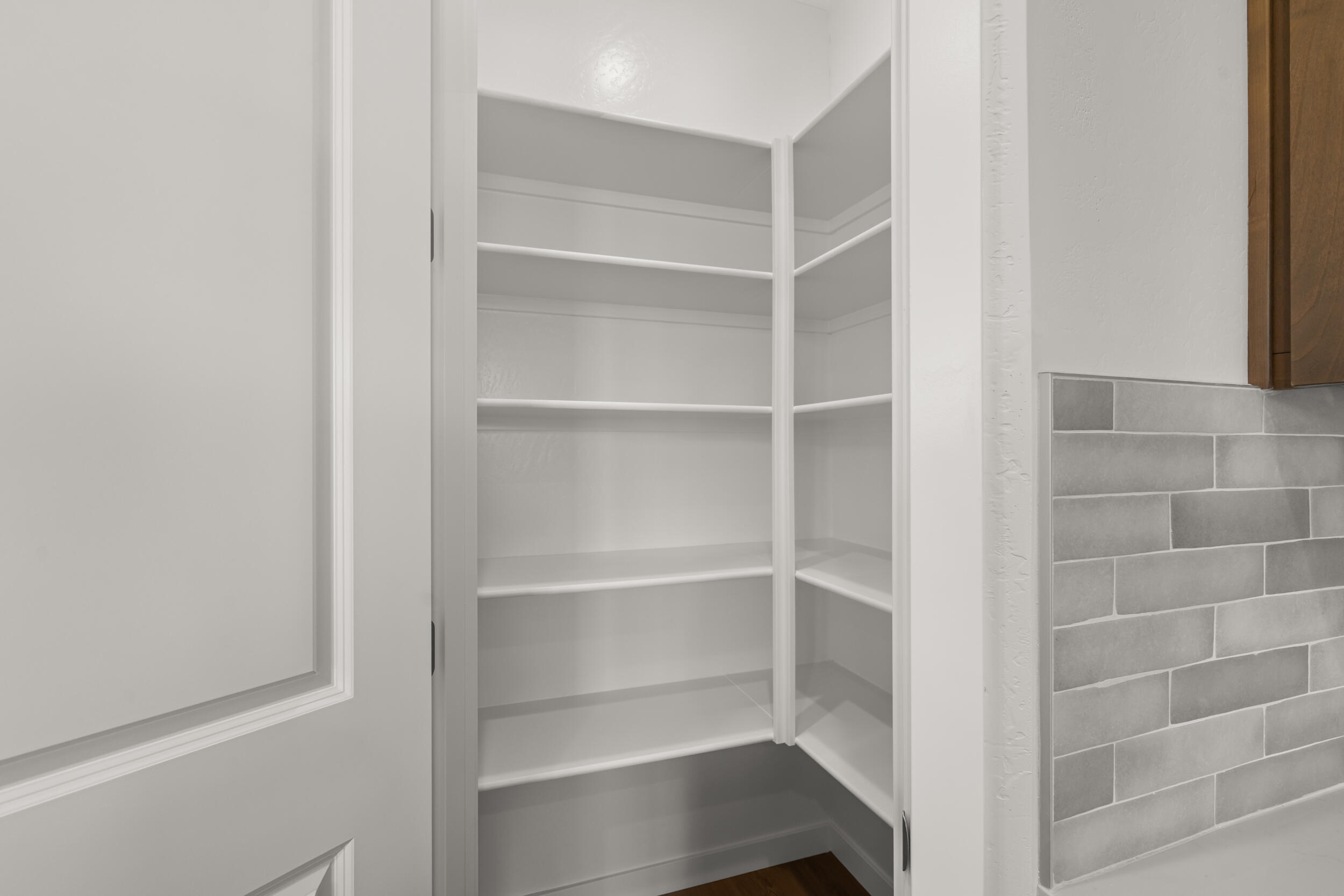 1141 Pumpkin Ridge, Unit 320 Eagle Point, OR 97524 - Photo 7 of 25 a view of walk in closet with empty racks