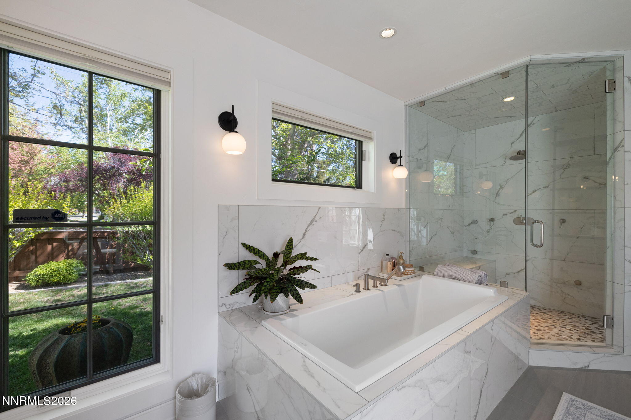 210 Bret Harte Avenue Reno, NV 89509 - Photo 19 of 40 a bath room with a sink a toilet and a shower