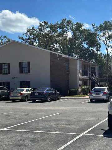a view of street with parked cars