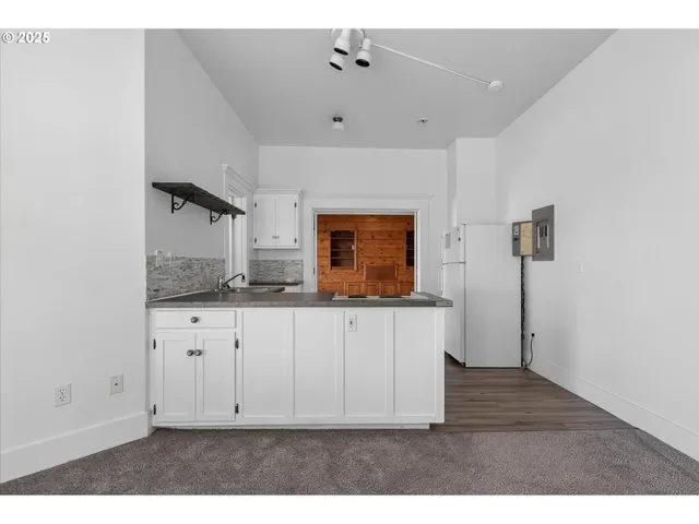 a view of cabinets with wooden floor