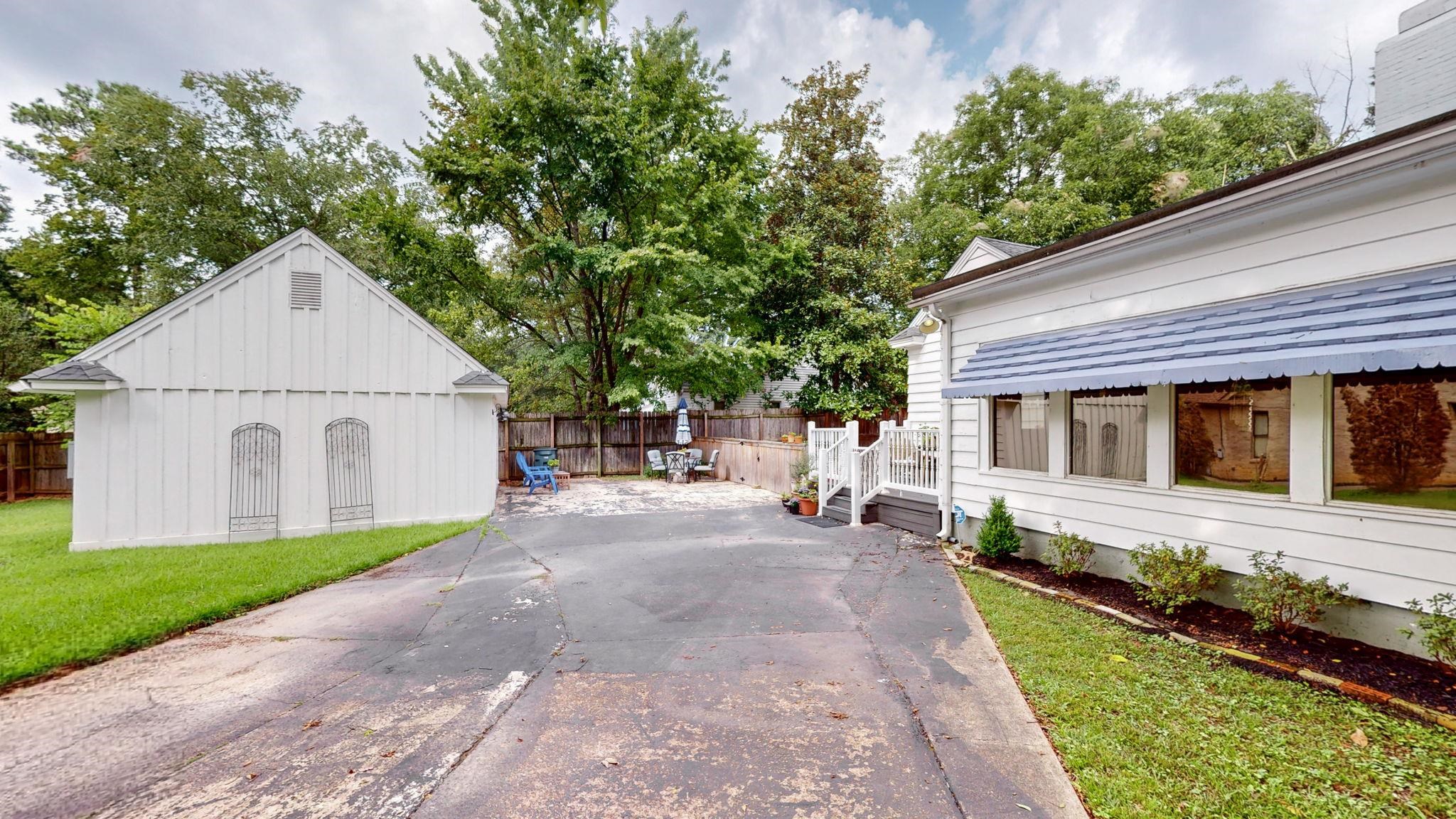 4572 Princeton Road Memphis, TN 38117 - Photo 2 of 36 a view of a house with a yard and large tree