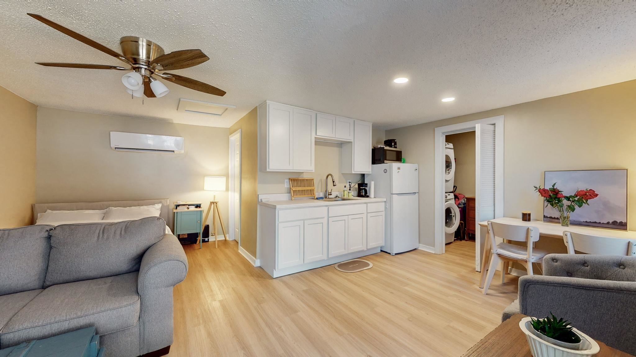 4572 Princeton Road Memphis, TN 38117 - Photo 26 of 36 a kitchen with stainless steel appliances a stove a sink cabinets and wooden floor