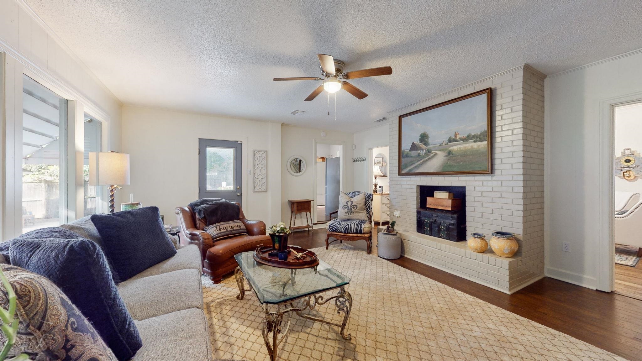 4572 Princeton Road Memphis, TN 38117 - Photo 3 of 36 a living room with furniture and a fireplace