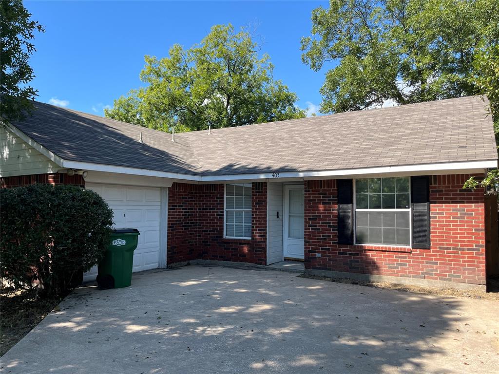 403 East R Ellis Avenue Fate, TX 75087 - Photo 1 of 15 a view of a house with potted plants and a large window