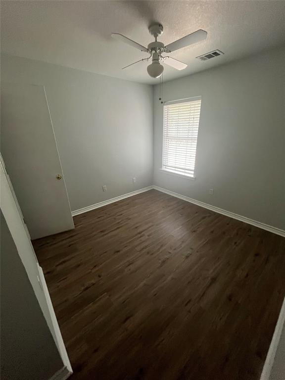 403 East R Ellis Avenue Fate, TX 75087 - Photo 11 of 15 a view of an empty room with wooden floor and a window