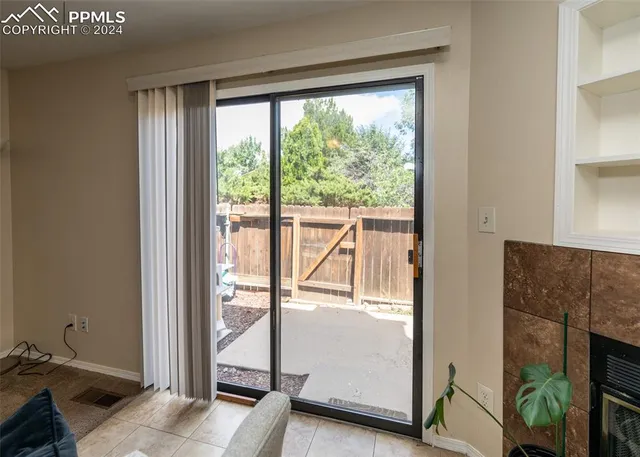 a view of a roof deck with wooden fence