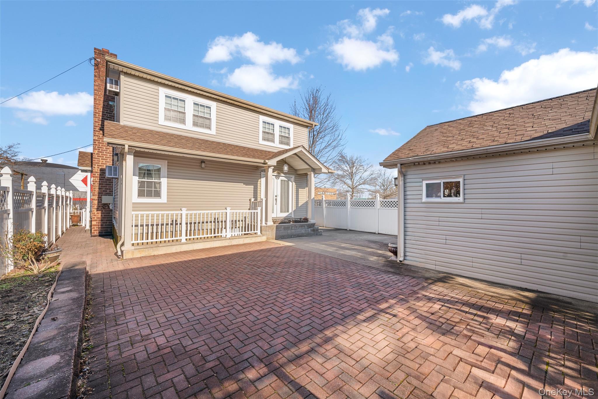 215 Rudolf Road Mineola, NY 11501 - Photo 6 of 14 a front view of a house with a yard