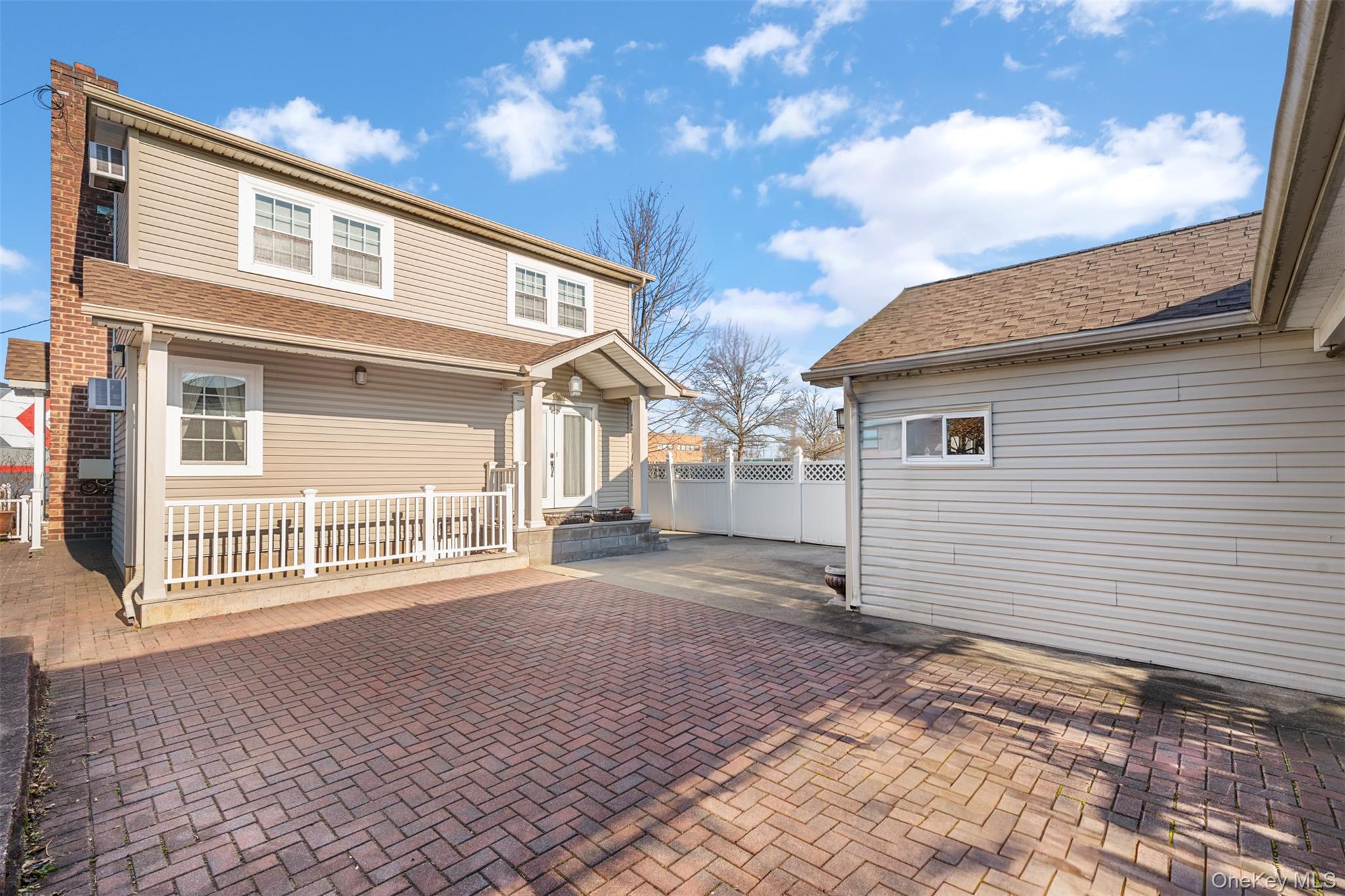 215 Rudolf Road Mineola, NY 11501 - Photo 7 of 14 a front view of a house with a yard